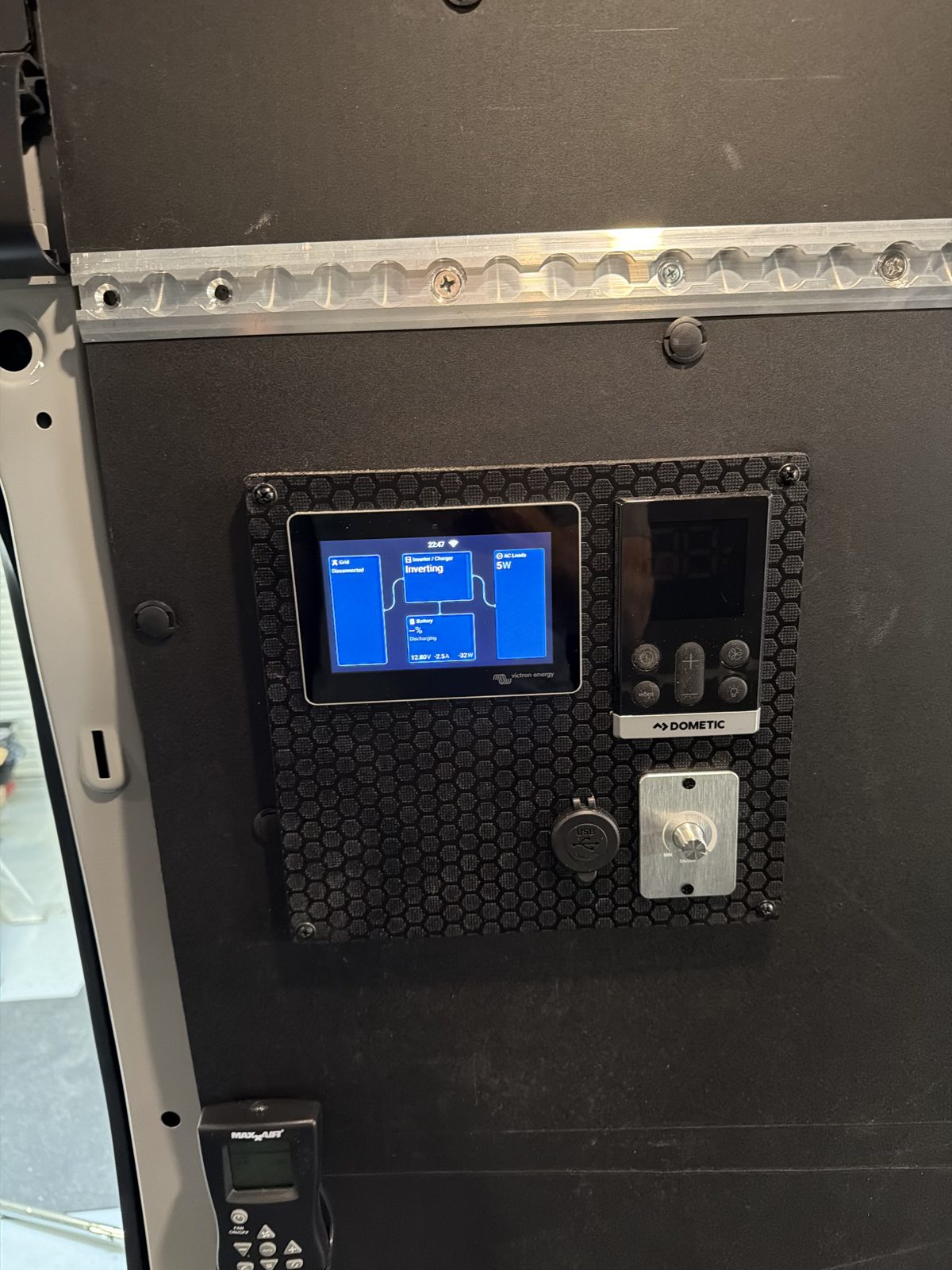 Victron touchscreen and Dometic air conditioner control mounted below L-track